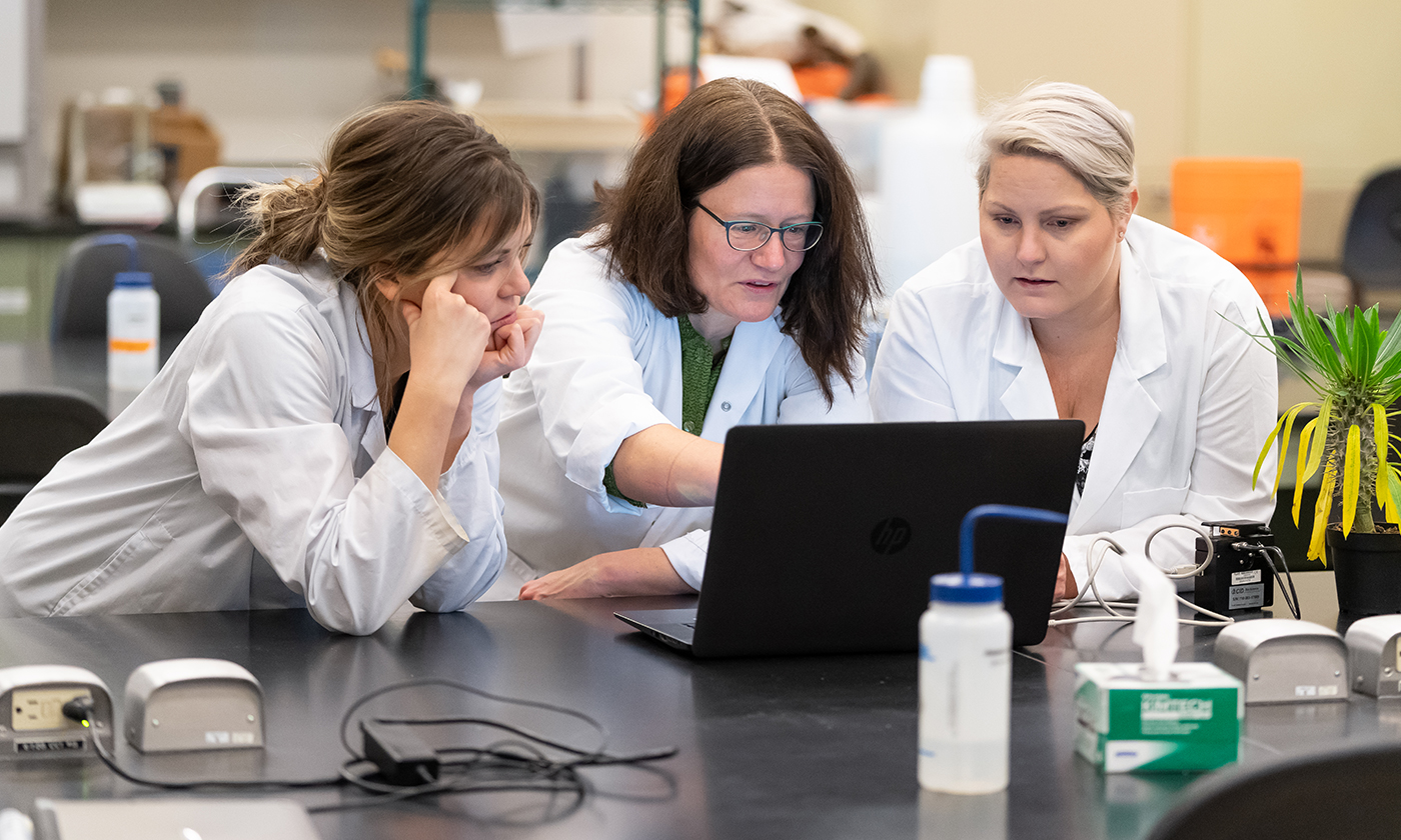 teacher and students doing research