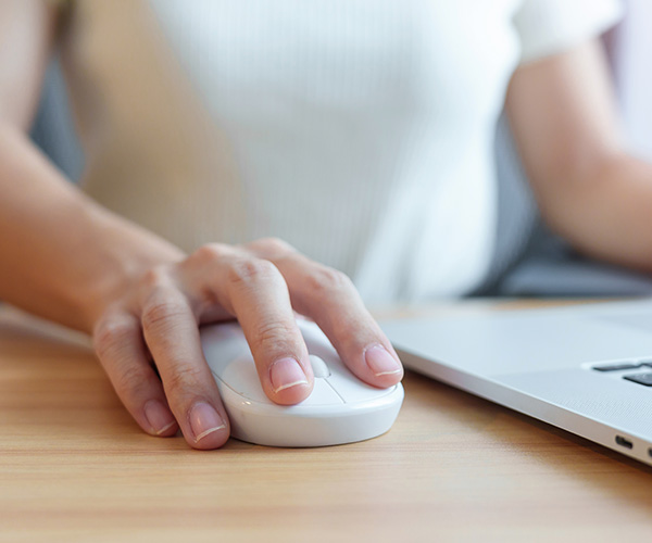 close up of hand on computer mouse