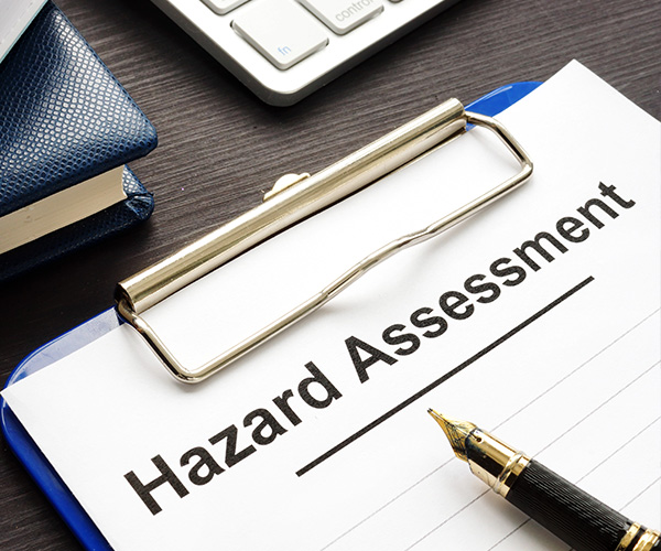 Hazard assessment form with clipboard on a desk