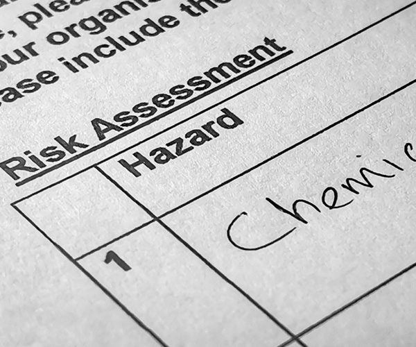 Hazard assessment form with clipboard on a desk