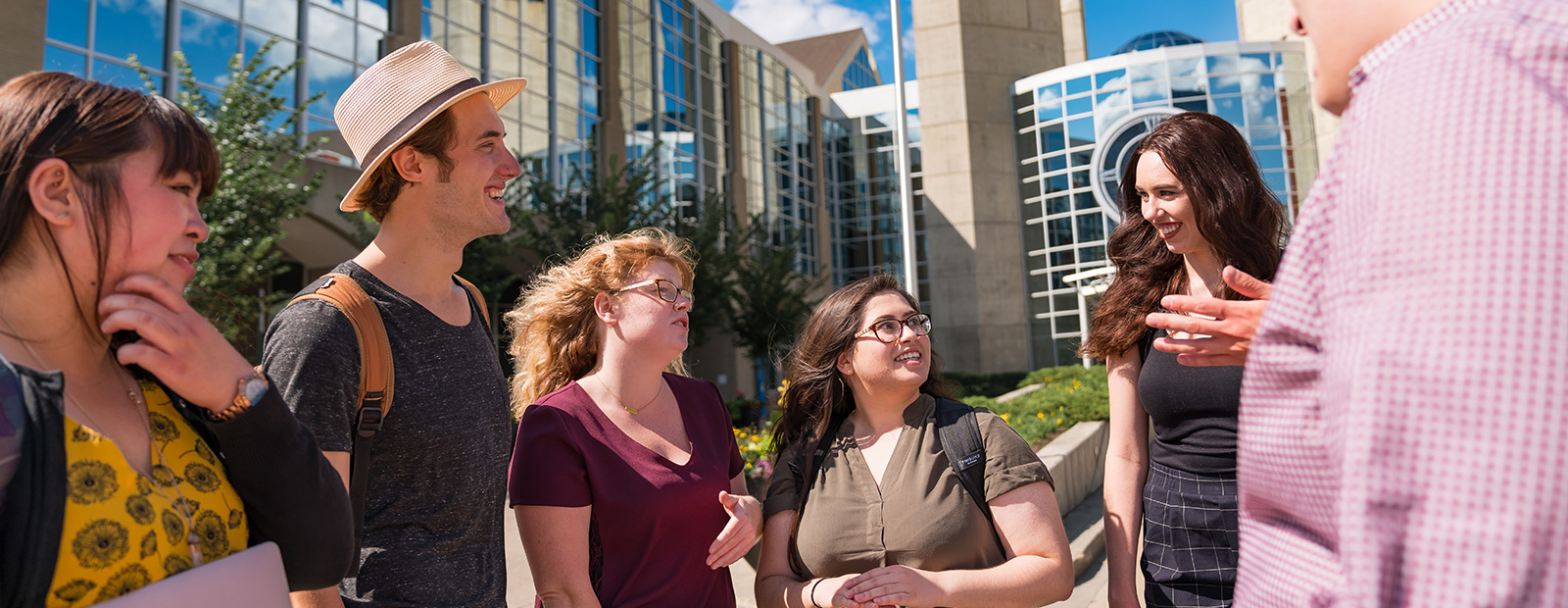 Students laughing outside macewan