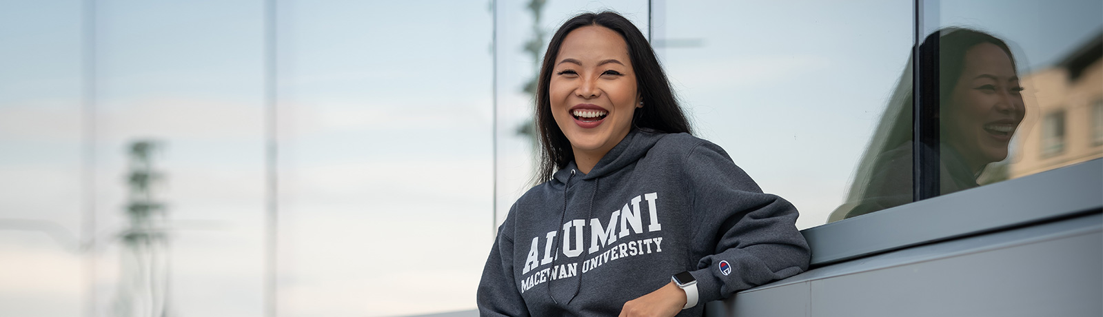 female student wearing alumni sweatshirt
