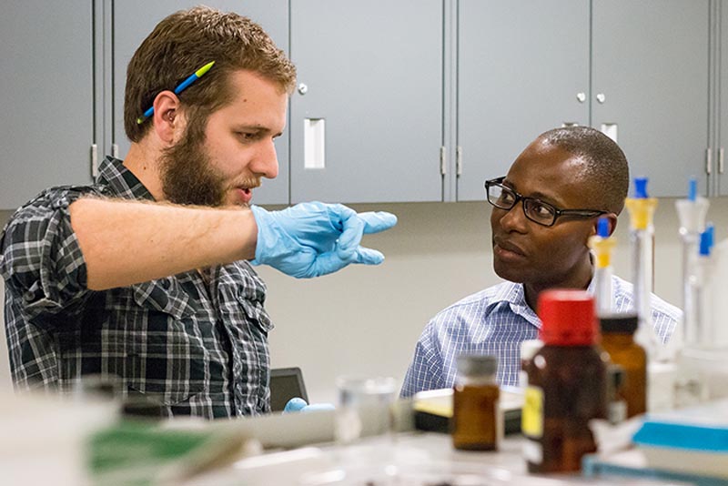  Dr. Samuel Mugo (right) with a student in the lab. In 2010