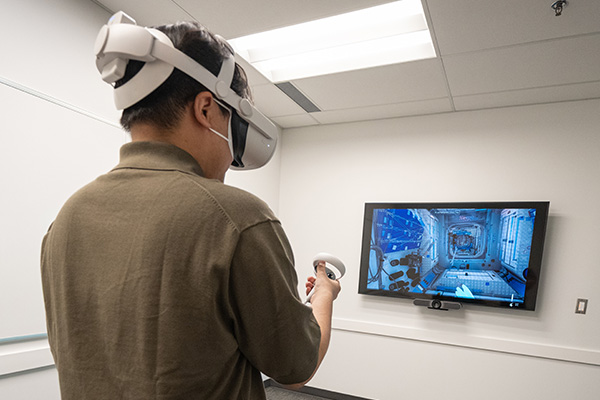 student using virtual reality equipment