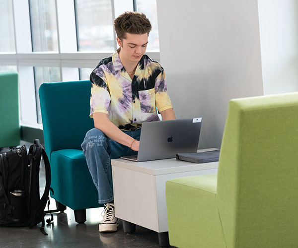 student working on laptop