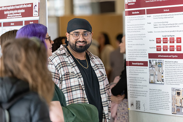 male student presenting his findings at Student Research Day