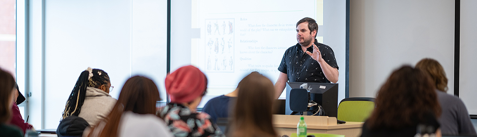 teaching in front of classroom photo.