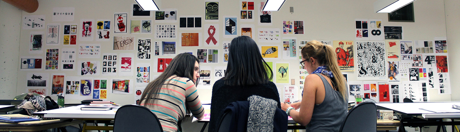 students talking with art pieces on walls
