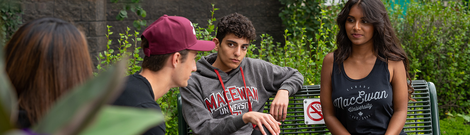 students sitting outside talking