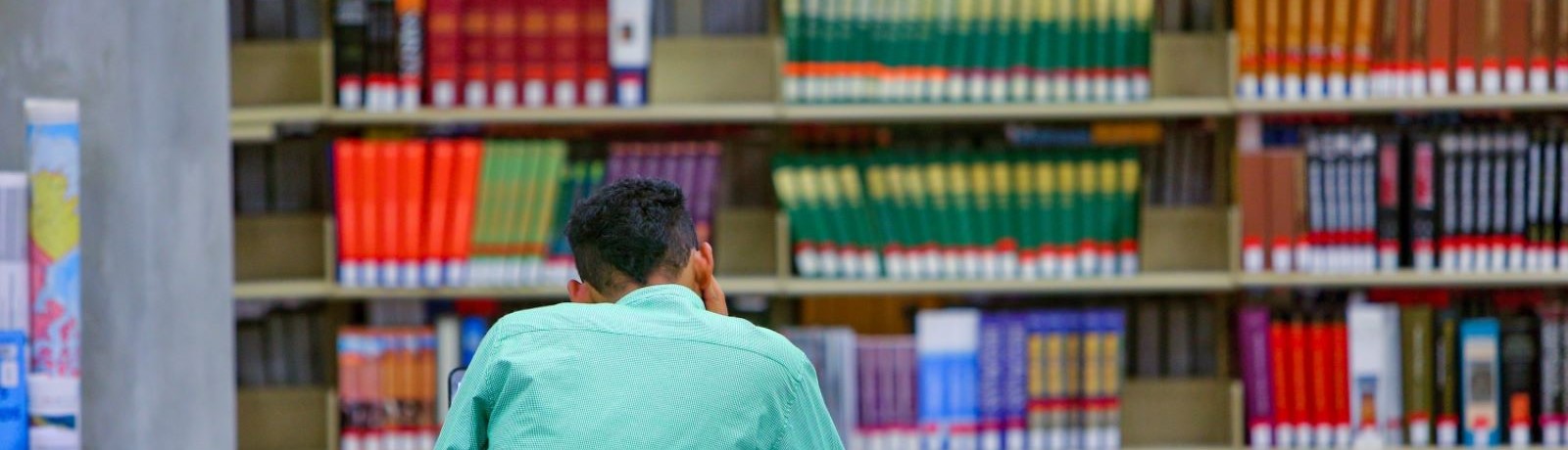 student studying in library