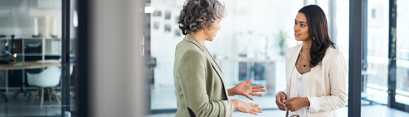 female student talking to woman in office