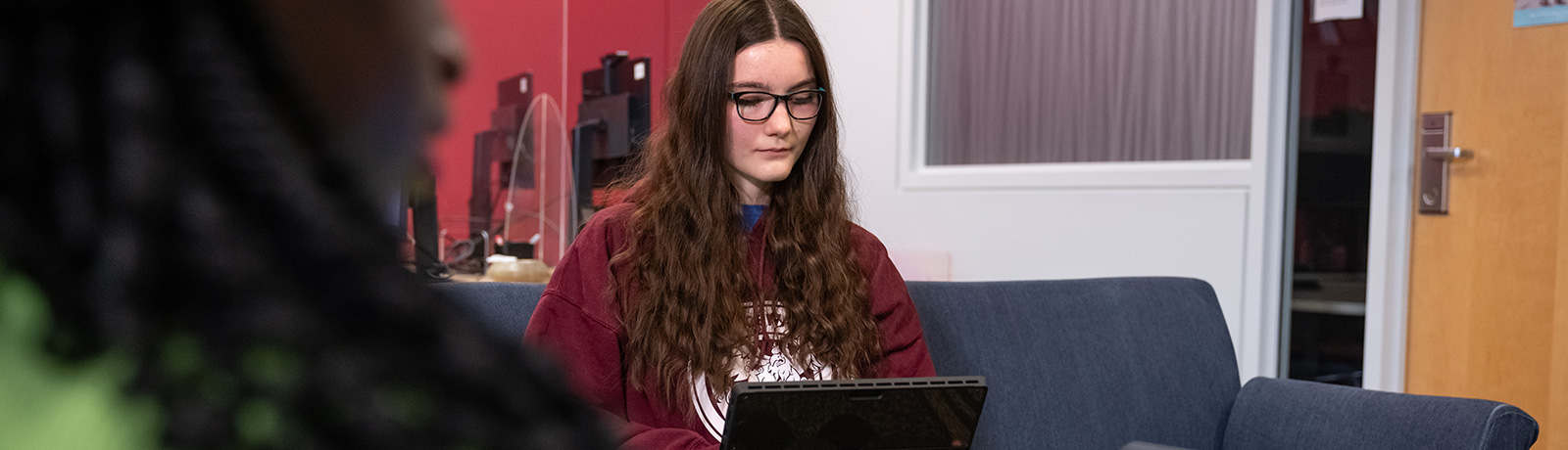 student looking at laptop