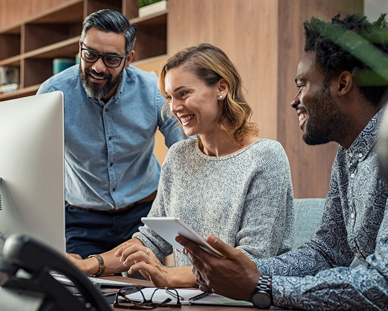 group of people sitting in front of computer