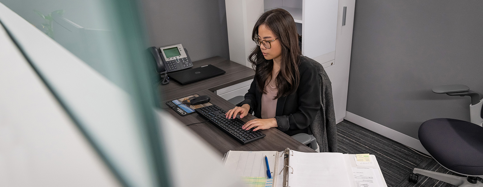 young woman working in office at computer