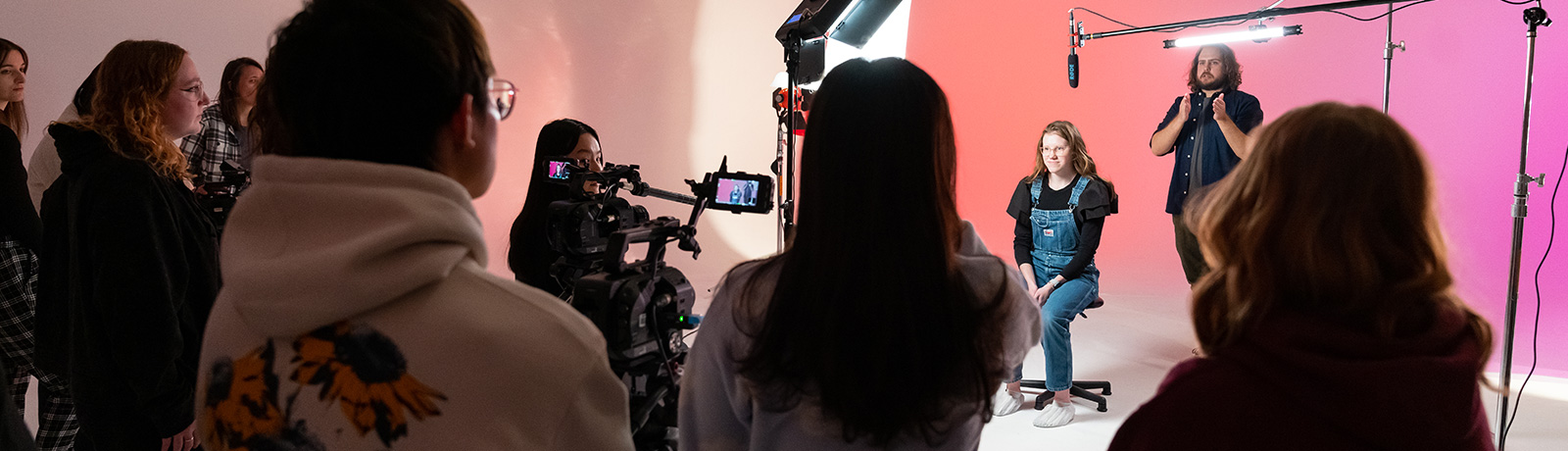 instructor with students in video studio