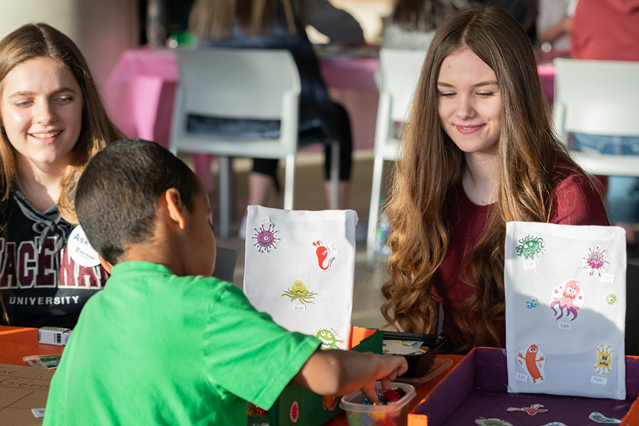 student working with child