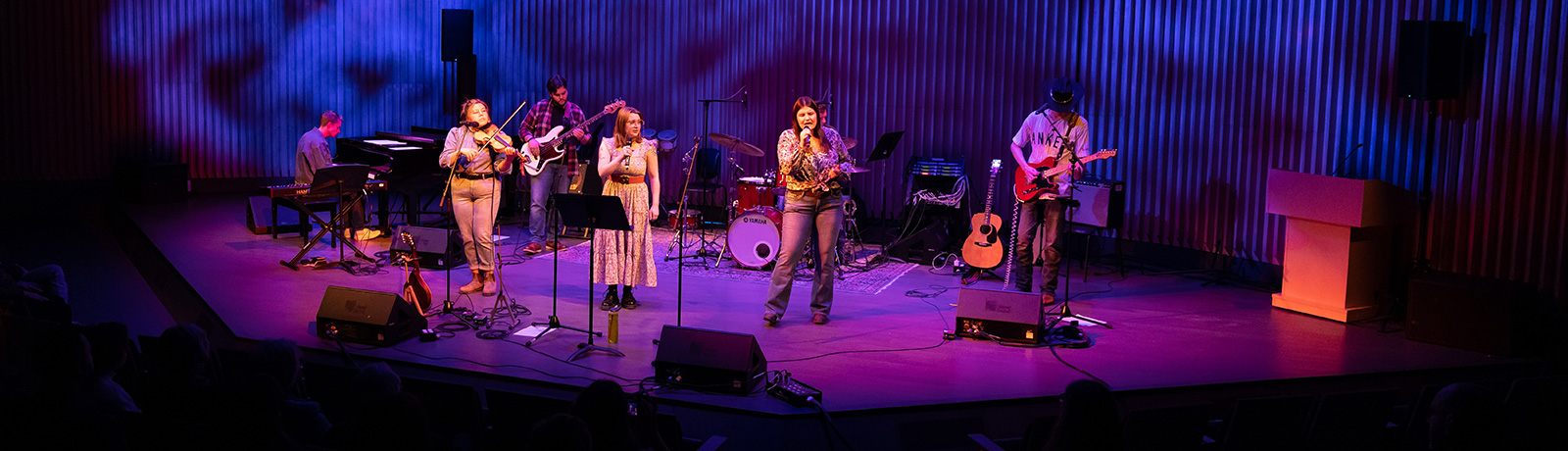 music students on stage performing