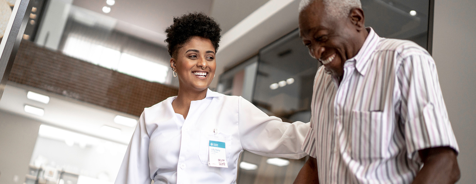 nurse helping elderly man