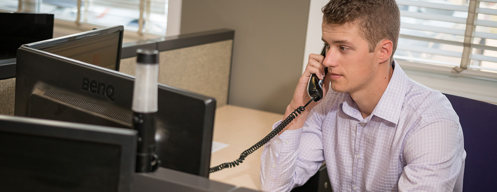 male on phone in office