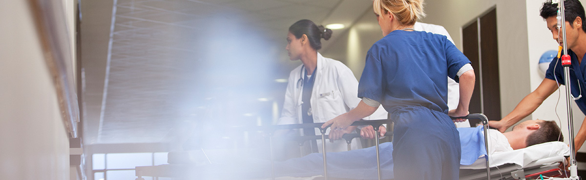 nurses rushing bed to surgery