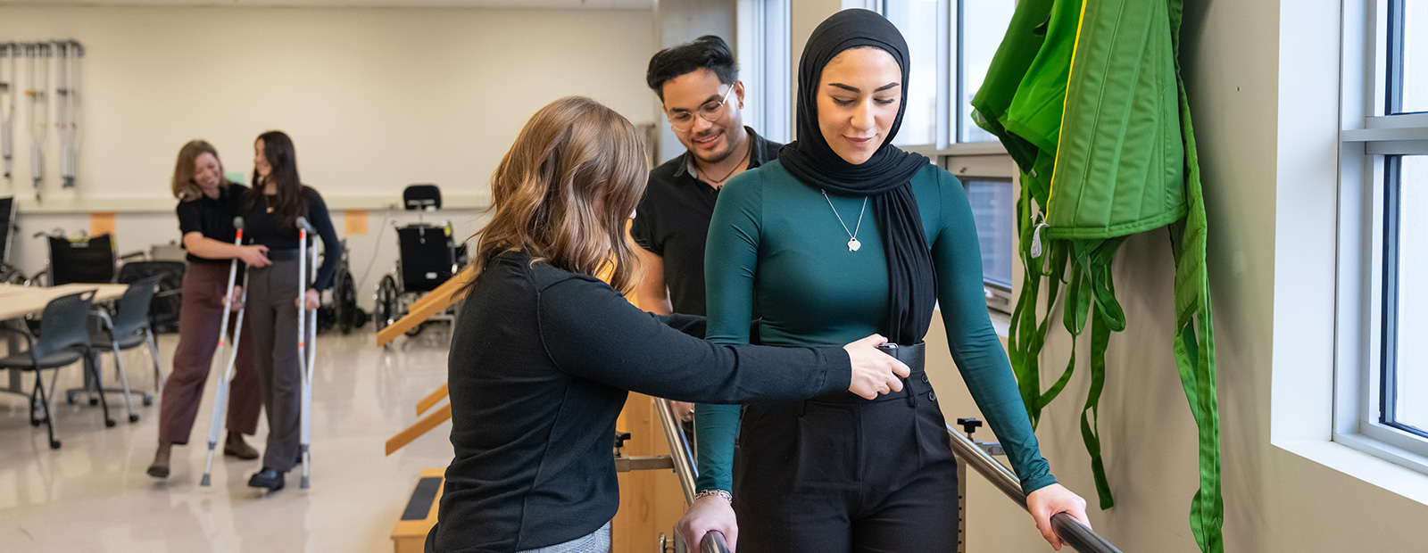 physical therapist students practicing in classroom