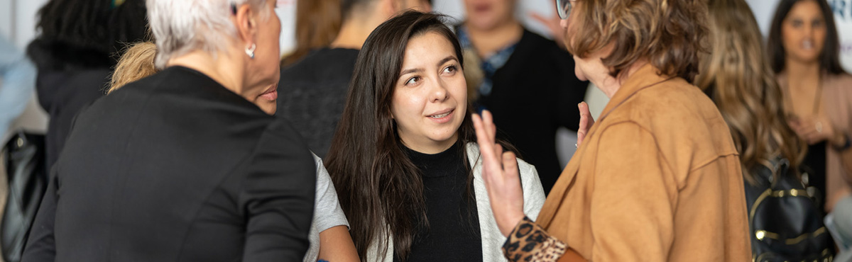 female student speaking to group of people