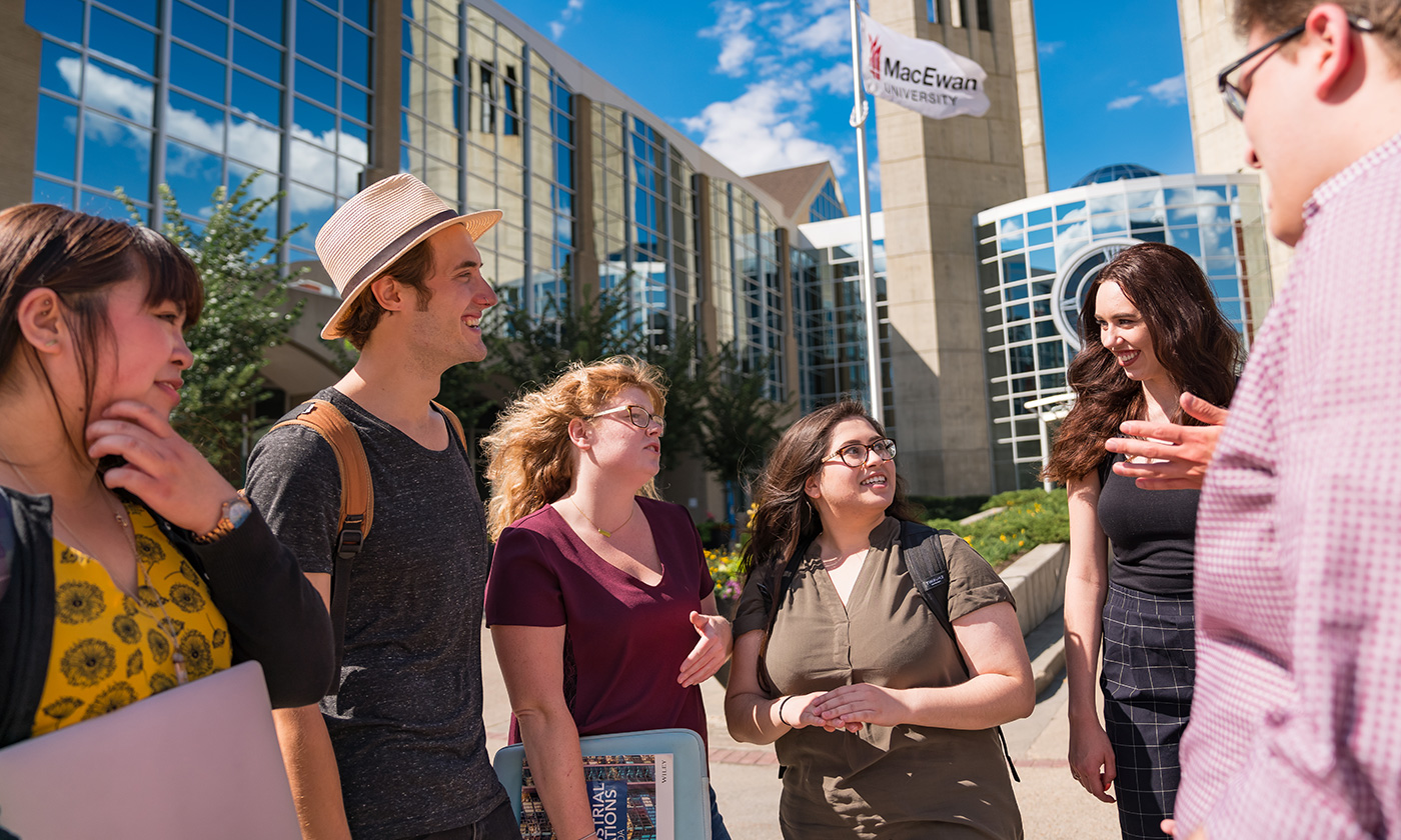 students talking outdoors on campus