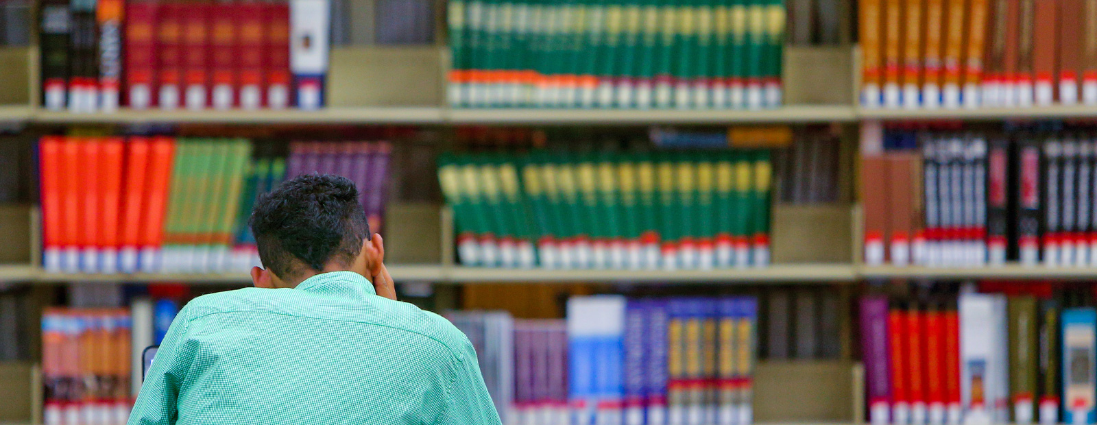 student in library