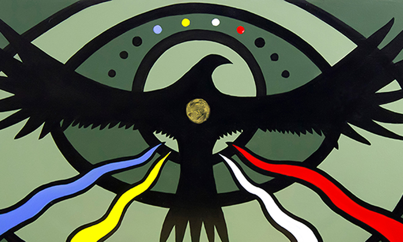 Two people sit at a table in kihêw waciston, one wearing a MacEwan University hoodie and the other wearing a ribbon skirt and cardigan.