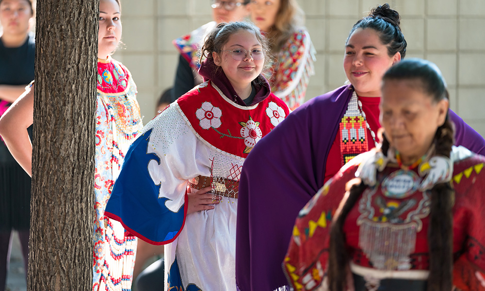 woman hugging female student