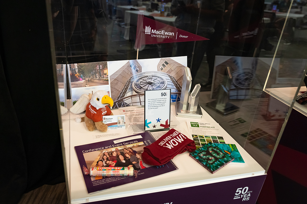 Time capsule items in a glass display box.