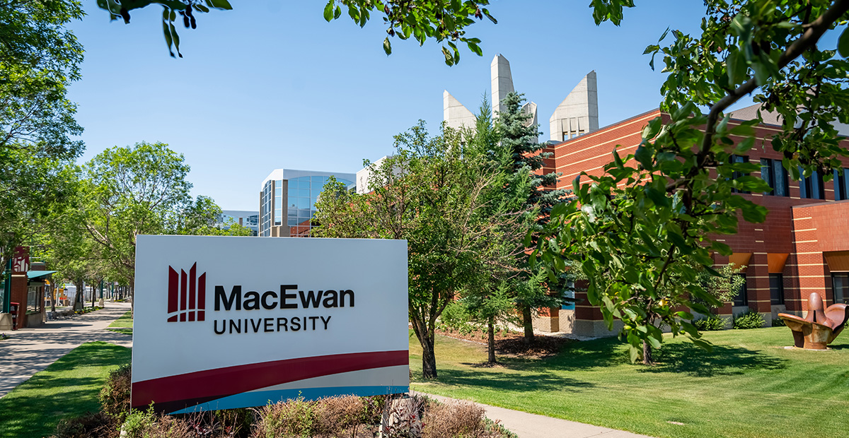 The MacEwan University sign outside of Building 5, with campus in the background