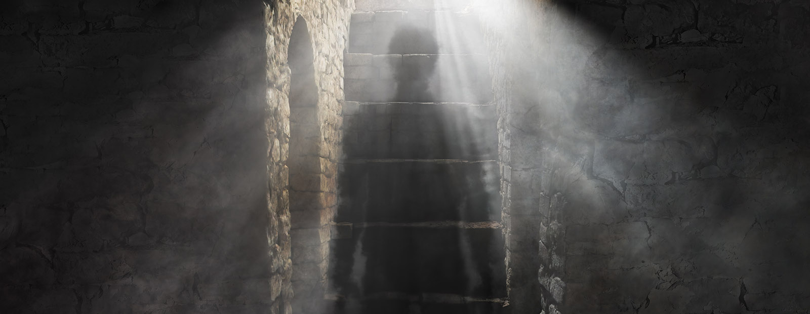 Image of a ghostly figure walking down a dark staircase