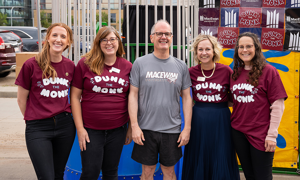 Image of MacEwan University staff standing together at an outdoor event