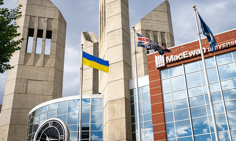 A Ukrainian flag flies outside of Building 6 at MacEwan's campus