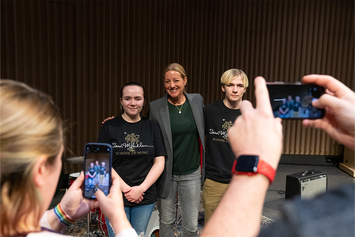 Sarah McLachlan poses with two students from her school of music