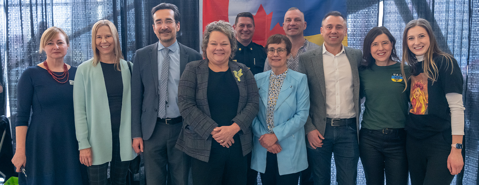 Larisa Hayduk, Oleksandr Danyleiko, Jackie Armstrong-Homeniuk, Dr. Annette Trimbee, Kevin Royle, Janice Krissa Moore all stand together for a photo.