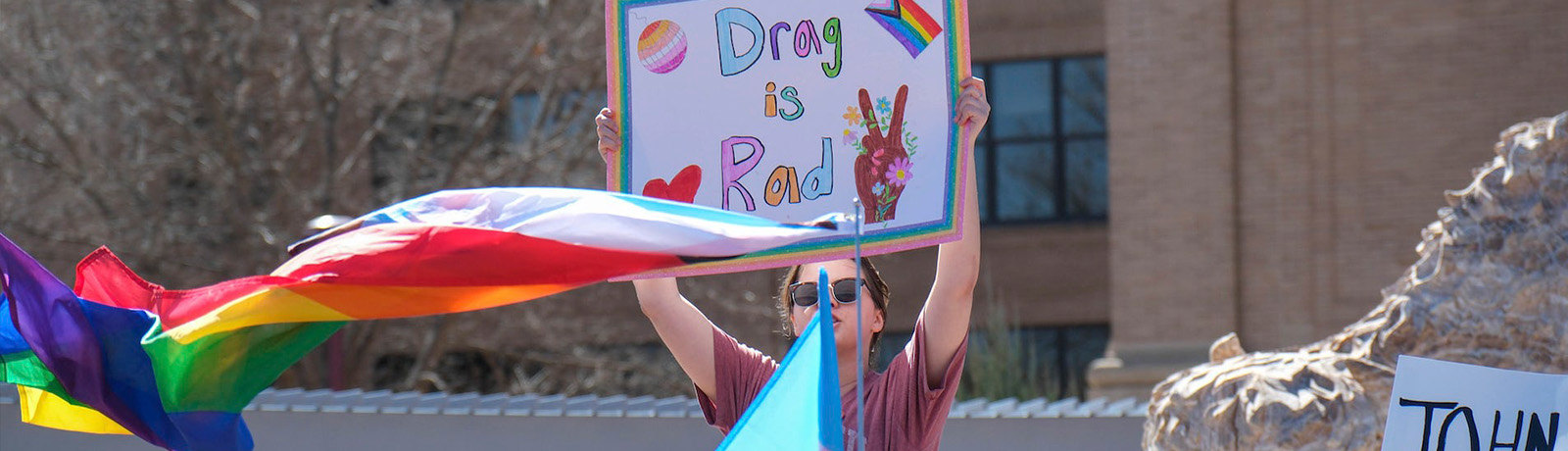 A protester holds a sign in a crowd