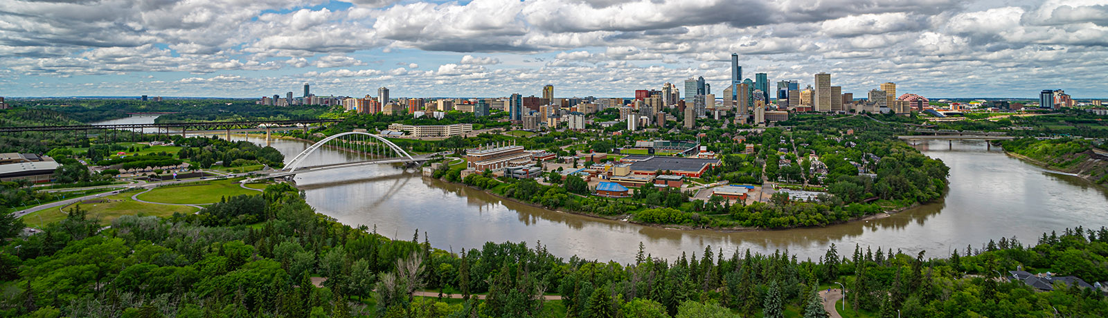 The North Saskatchewan River curves through the landscape with Edmonton's skyline in the background