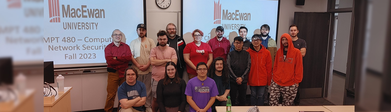 Students in CMPT 480 stand at the front of the classroom