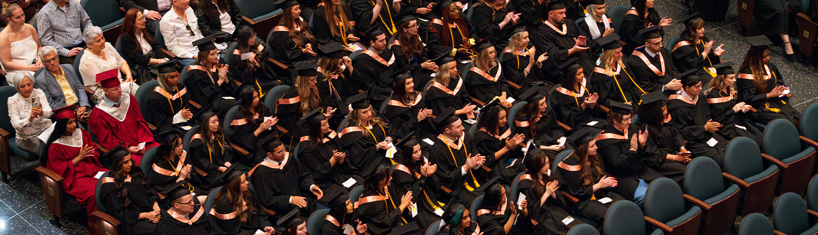 A view from above of grads sitting in the Winspear at convocation.