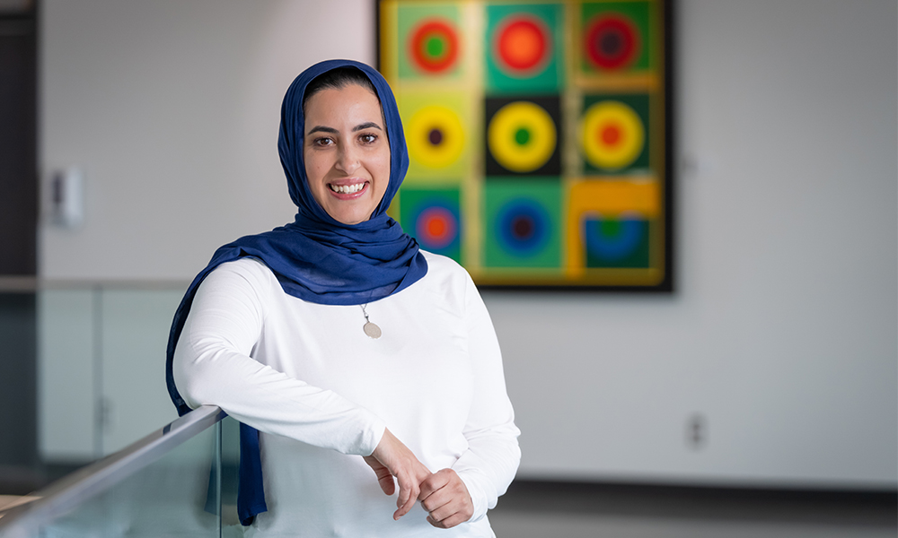 Sara Grewal, associate professor of English, smiling at the camera. 