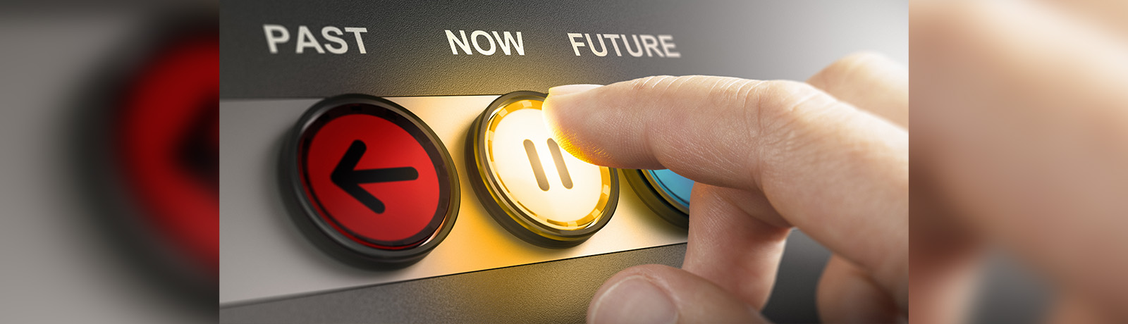 A series of three buttons, with the words past, now, future above the buttons, and a finger of a hand about to push the button below the word now, and the button has a pause symbol on it.