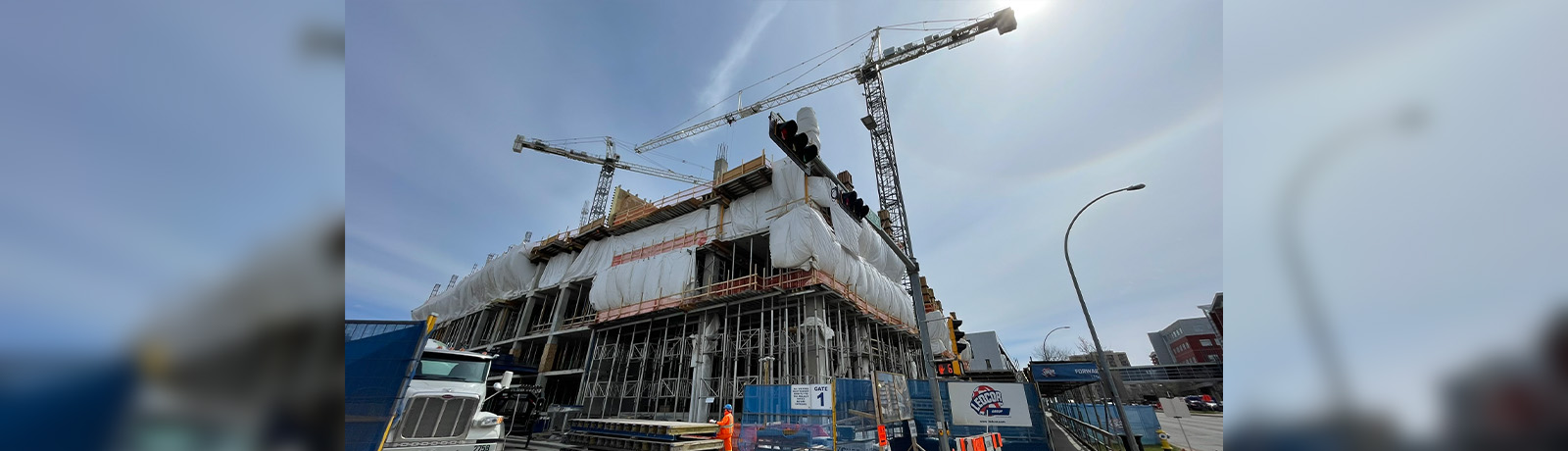 A photo of the current construction on the new building taken from ground level, looking up at the structure.