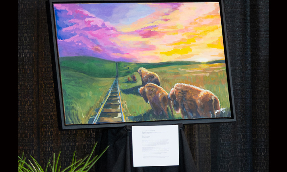 a picture of a painting of a sunset scene with a railroad and buffalo 
