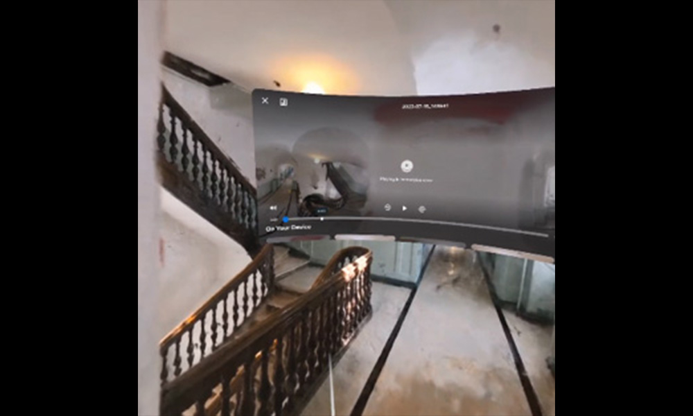 A photo of a screen with images of a staircase