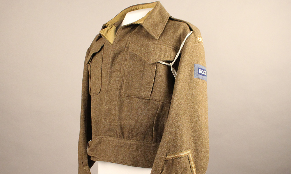 Photo of a brown military jacket on a mannequin. Courtesy of the Royal Alberta Museum.