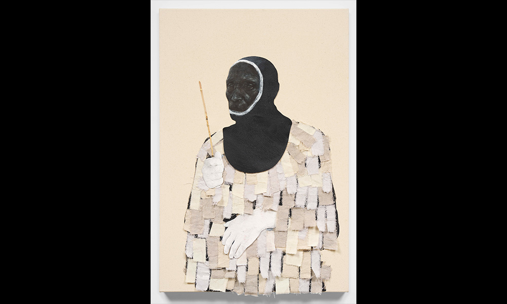 A portrait of a man wearing a black hood and a textured white sweater, holding a skinny piece of wood.