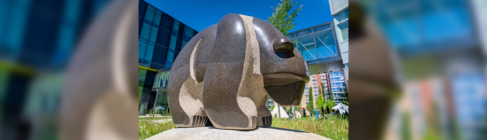 photograph of a large stone carving of a bear