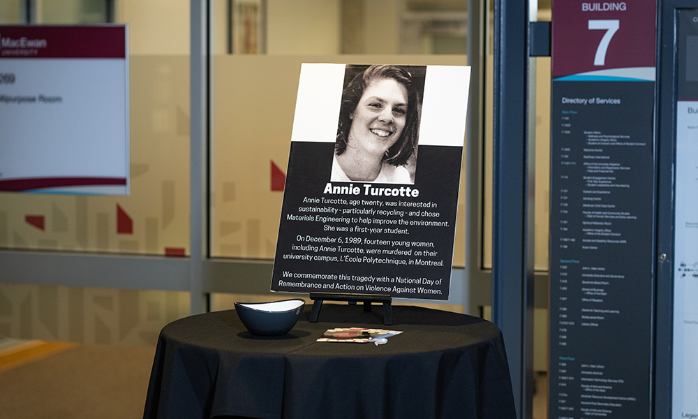 A plaque of a woman's photo, her name and a description
